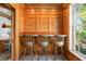 Bar area with white quartz countertops and bar stools at 2196 Muskogee Trl, Nokomis, FL 34275