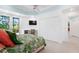 Bright bedroom with a desk area, large closet, and a view of the screened lanai at 2196 Muskogee Trl, Nokomis, FL 34275