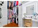 Organized walk-in closet with custom shelving, vanity, and ample hanging space at 2196 Muskogee Trl, Nokomis, FL 34275