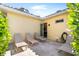Outdoor patio features lounge chairs, and doorway access to interior at 2196 Muskogee Trl, Nokomis, FL 34275