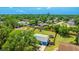 Detailed aerial shot highlighting the property's backyard, landscaping, and neighborhood features at 2237 Lockwood Meadows Cir, Sarasota, FL 34234