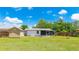 View of a large backyard with shed and enclosed porch; perfect for outdoor living at 2237 Lockwood Meadows Cir, Sarasota, FL 34234
