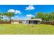 Large backyard with wood fence, utility shed, and plenty of green grass at 2237 Lockwood Meadows Cir, Sarasota, FL 34234
