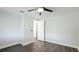 Bright bedroom with modern ceiling fan, light blue walls, and wood-look floors at 2237 Lockwood Meadows Cir, Sarasota, FL 34234