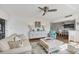Bright living room that transitions to a dining area with counter top seating at 225 Hourglass Way # 306, Sarasota, FL 34242