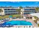 Bright community pool with plenty of lounge chairs with a nice patio area at 225 Hourglass Way # 306, Sarasota, FL 34242