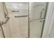 The shower includes a handheld shower head, grab bars, and sliding glass doors at 2417 Riverbluff Pkwy # 235, Sarasota, FL 34231