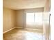 Neutral bedroom with tiled floors, a large window, and plenty of natural light at 2938 Clark Rd # 203, Sarasota, FL 34231