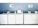 The laundry room has several energy-efficient washing machines and dryers at 2938 Clark Rd # 203, Sarasota, FL 34231