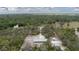 Aerial view showcases home, garage and vast acreage with wooded surroundings, privacy at 31860 Taylor Grade Rd, Duette, FL 34219