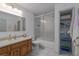 Bright bathroom features a shower with glass door, spacious vanity, and a linen closet at 31860 Taylor Grade Rd, Duette, FL 34219