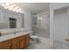 Updated bathroom featuring tiled shower, wood vanity, and modern fixtures at 31860 Taylor Grade Rd, Duette, FL 34219