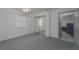 Bright bedroom featuring neutral carpet, white walls, and a mirrored closet at 31860 Taylor Grade Rd, Duette, FL 34219
