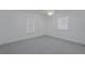 Neutral bedroom offers plush carpet, white walls, and a ceiling fan at 31860 Taylor Grade Rd, Duette, FL 34219