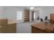 Office/bedroom with built-in shelving units, neutral carpet, and desk area at 31860 Taylor Grade Rd, Duette, FL 34219