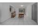 A dining room features a wooden table, four chairs, a breakfast bar, and a sliding glass door at 31860 Taylor Grade Rd, Duette, FL 34219