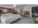 Spacious main bedroom showcasing neutral carpet, wood furnishings and ensuite bath and closet at 31860 Taylor Grade Rd, Duette, FL 34219