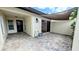 Private back patio with brick pavers and partial shade awning, perfect for outdoor living and entertaining at 3409 Montilla Ct # 8410, Sarasota, FL 34232