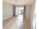 Bright bedroom with tile floors and sliding glass doors leading to outdoor patio at 3409 Montilla Ct # 8410, Sarasota, FL 34232