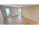 Neutral bedroom with tiled floors, ceiling fan, and window with blind and garden door at 3409 Montilla Ct # 8410, Sarasota, FL 34232