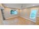 Spacious bedroom with neutral walls, two windows, ceiling fan, and tiled floor at 3409 Montilla Ct # 8410, Sarasota, FL 34232