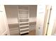 Walk in closet with custom shelving at 3409 Montilla Ct # 8410, Sarasota, FL 34232