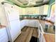 Well-equipped kitchen features white cabinets, modern appliances, and ample counter space at 3409 Montilla Ct # 8410, Sarasota, FL 34232