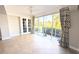 Inviting living room with screened windows, garden views, and double french doors at 3409 Montilla Ct # 8410, Sarasota, FL 34232