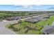 Expansive aerial view showcasing the community's well-maintained homes, landscaping, and amenities at 3443 74Th Avenue E Cir, Sarasota, FL 34243