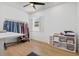 Bright home office/bedroom featuring stylish decor, a shuttered window and wood-look floors at 3443 74Th Avenue E Cir, Sarasota, FL 34243