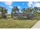Elegant community sign set amidst palm trees, creating a welcoming entrance at 3443 74Th Avenue E Cir, Sarasota, FL 34243