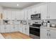 Well-appointed kitchen featuring modern appliances, stylish cabinetry, and ample counter space at 3443 74Th Avenue E Cir, Sarasota, FL 34243