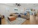Inviting living room with stylish decor, a large sectional sofa, and a view of the outdoor patio at 3443 74Th Avenue E Cir, Sarasota, FL 34243