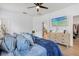 Bright bedroom with modern decor, neutral tones, and a view into the large walk-in closet at 3443 74Th Avenue E Cir, Sarasota, FL 34243