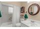 Bathroom with combination tub/shower and single sink vanity at 3459 Lotus Rd, North Port, FL 34291