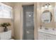 Bathroom featuring shower, vanity, mirror and tiled floors at 3459 Lotus Rd, North Port, FL 34291