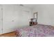 Bedroom with wood floors, closet, and room for storage at 3459 Lotus Rd, North Port, FL 34291