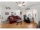 Cozy living room with comfortable seating, hardwood floors, and plenty of natural light at 3459 Lotus Rd, North Port, FL 34291