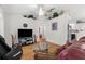 Spacious living room featuring hardwood floors, stylish decor, and an open layout at 3459 Lotus Rd, North Port, FL 34291