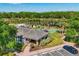 Community clubhouse with parking, tennis courts, and a serene lake, perfect for active lifestyles at 3519 Founders Club Dr, Sarasota, FL 34240