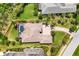 An aerial view of the beautiful home showcases the private pool and lush landscaping at 3519 Founders Club Dr, Sarasota, FL 34240