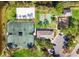 Overhead view of recreational facilities: tennis, volleyball, basketball courts, playground, and clubhouse at 3519 Founders Club Dr, Sarasota, FL 34240