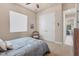This bedroom offers carpeted floors, a ceiling fan, large closet and seahorse decor at 3519 Founders Club Dr, Sarasota, FL 34240