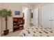 Bedroom with adjacent bathroom, bookcase, and tropical themed bedding at 3519 Founders Club Dr, Sarasota, FL 34240