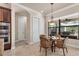 Cozy breakfast nook bathed in natural light, featuring a charming dining set and serene outdoor views at 3519 Founders Club Dr, Sarasota, FL 34240