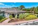 Well-maintained community clubhouse with inviting entrance, lush landscaping, and ample parking at 3519 Founders Club Dr, Sarasota, FL 34240