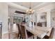 Open-concept dining area showcases seamless flow to living spaces and abundant natural light at 3519 Founders Club Dr, Sarasota, FL 34240