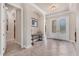 Bright foyer featuring tile flooring, arched doorways, and elegant double doors at 3519 Founders Club Dr, Sarasota, FL 34240