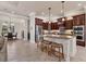 Spacious kitchen featuring a central island, stainless steel appliances, and open access to the dining area at 3519 Founders Club Dr, Sarasota, FL 34240