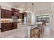Kitchen boasts custom cabinetry, granite counters, and a spacious island for meal prep and casual dining at 3519 Founders Club Dr, Sarasota, FL 34240